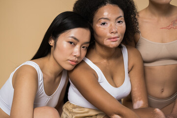 Multiracial girls posing together at the studio
