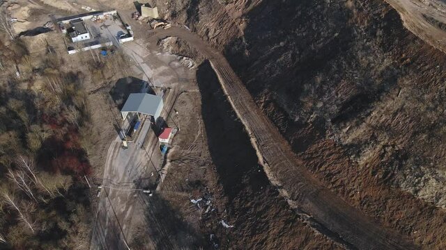 Flight over the landfill of household waste. Mothballed city dump.