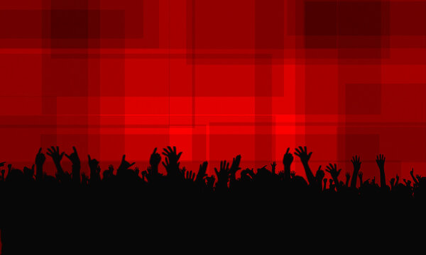 Silhouettes of young people at a concert