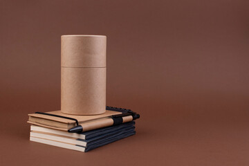 Eco-friendly stationery. Office desk with a paper notepad and a box of pencils. Contemporary workspace for men, minimalist style. High quality photo. Copy space