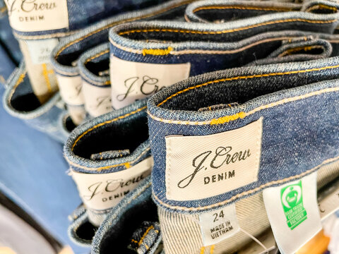 Stack of Jcrew denim jeans on display at Jcrew store on March 29, 2021 in Charleston, South Carolina