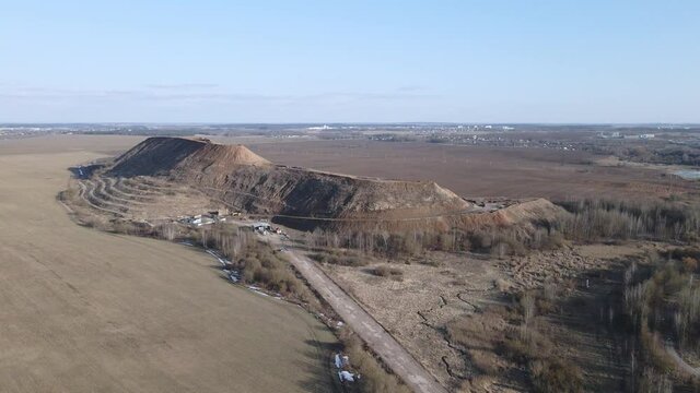 Flight over the landfill of household waste. Mothballed city dump.