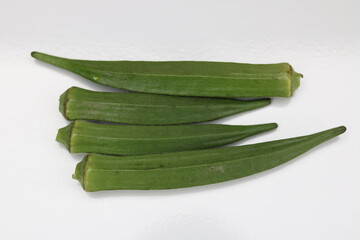 Fresh Young okra or green roselle on white background.