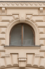  Windows in the city in the old style, with stucco, decorative elements
