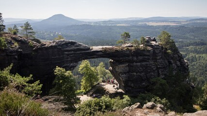 Sandstone gate Pravcicka brana during sunny day, in Bohemian Switzerland, Czechia