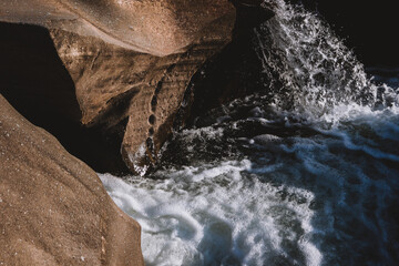 Water stream flowing on rock formations.Golden Hour landscape.