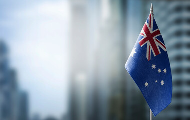 A small flag of Australia on the background of a blurred background