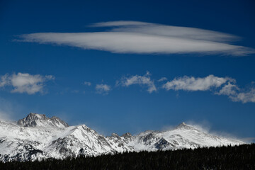 Panoramic  view to the mountains on a  sunny day with white clouds at Vail, Colorado