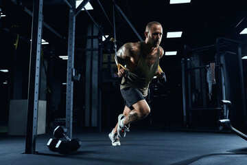 Fototapeta na wymiar Sportsman running in place in gym.
