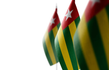 Small national flags of the Togo on a white background