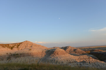 Landscape view of the unusual rock formations at Badlands National Park in South Dakota at sunset