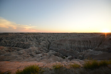 Landscape view of the unusual rock formations at Badlands National Park in South Dakota after sunset at twilight