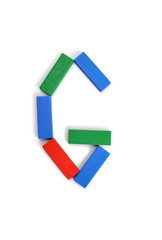 Letter G of the English alphabet made of wooden colored blocks, bricks of a children's construction kit