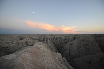 Landscape view of the unusual rock formations at Badlands National Park in South Dakota after sunset at twilight