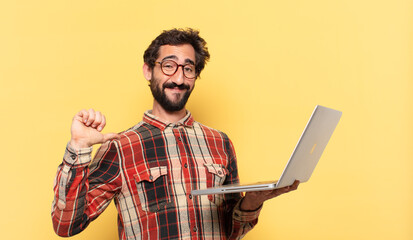 young crazy bearded man happy expression and a laptop