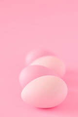 Minimal pink easter eggs on pink background