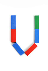 Letter U written with colored wooden blocks isolated on white