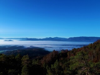 Fog covered Gorenjska region of Slovenia and hills behind