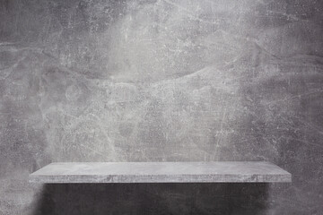 Wooden shelf at wall of stone or marble surface background tile texture.  Book shelf and grey wall © Sergii Moscaliuk