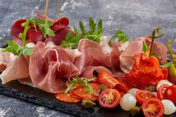 meat appetizer on teh stone board