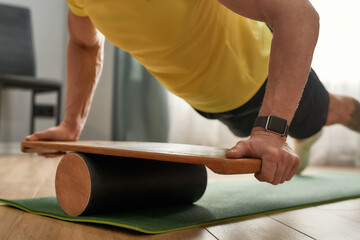 Selective focus on balance board used by athlete