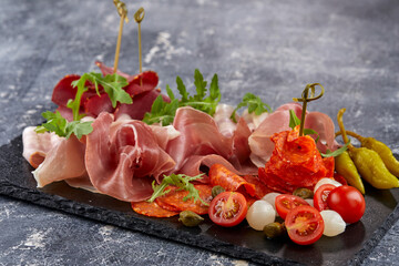 meat appetizer on teh stone board