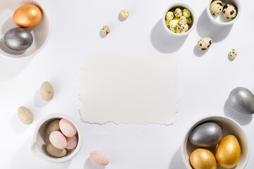 Many multi-colored Easter eggs in bowls of different sizes on a white background