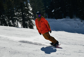 Man snowboarding on snowy hill. Extreme winter sports. Action shot. Vail ski resort, Colorado