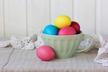 bowl with colored Easter eggs on the table.