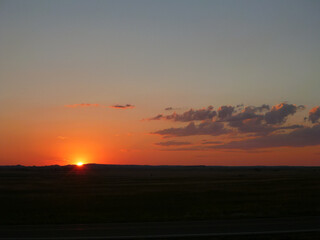 Sun setting over the landscape at Badlands National Park in South Dakota