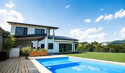 House with swimming pool outdoors in backyard garden. - obrazy, fototapety, plakaty