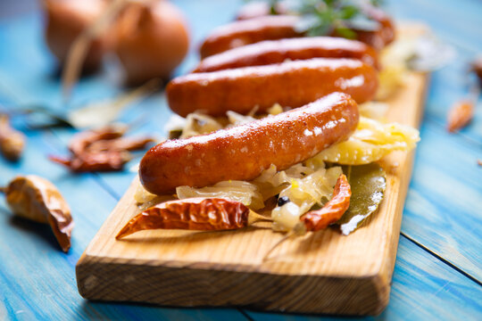 Grilled german sausage links with sauerkraut