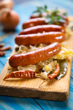 Grilled german sausage links with sauerkraut