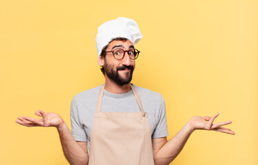 young bearded chef man doubting or uncertain expression