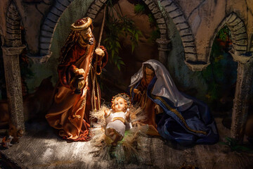 Artistic nativity scene representing the Divine Child Jesus, Saint Mary and Saint Joseph in the...