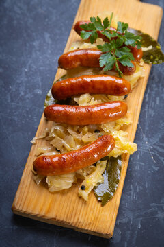 Grilled german sausage links with sauerkraut