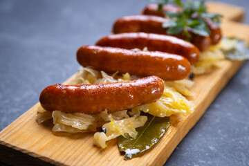 Grilled german sausage links with sauerkraut