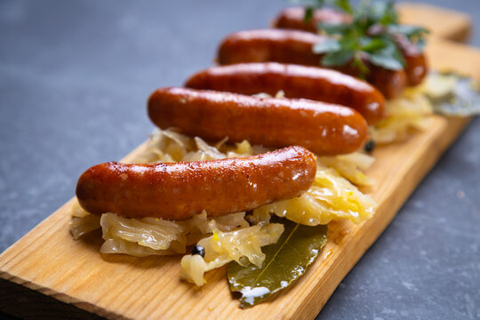 Grilled german sausage links with sauerkraut