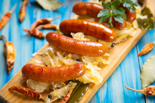 Grilled german sausage links with sauerkraut