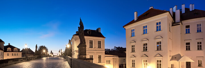 Fototapeta na wymiar Prague at night, illuminated historical houses and Charles Bridg