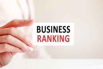business ranking written on a paper card in woman hand
