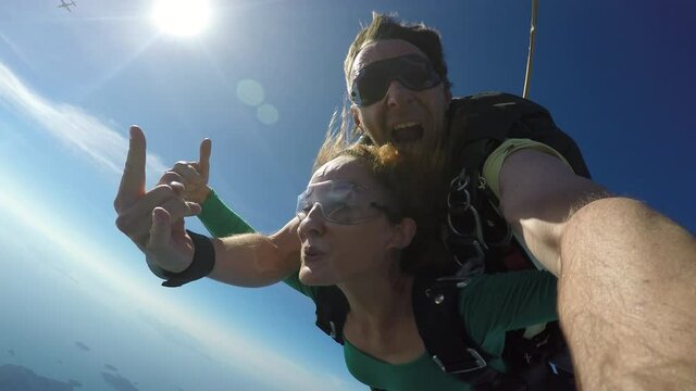 Sky dive tandem over the sea. 4K resolution. 