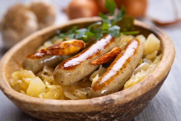 Grilled german sausage links with sauerkraut