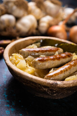 Grilled german sausage links with sauerkraut
