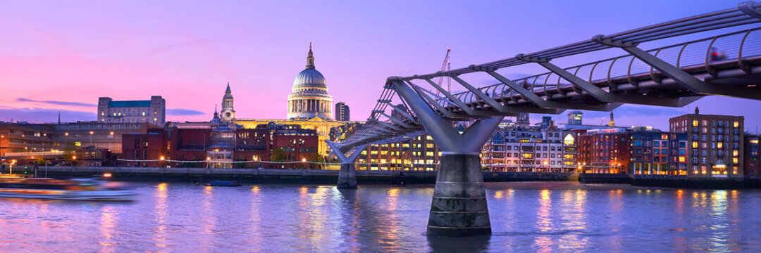 London at sunset, Millennium bridge leading towards illuminated