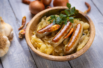 Grilled german sausage links with sauerkraut