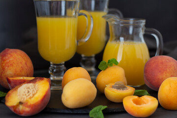Fresh fruits. Healthy food. Mixed fruit, apricots and peaches. Studio photography of various fruits on an old wooden table. Organic healthy assorted fruits. Assortment of fresh fruit. Fresh Juice.