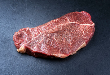 Traditionelles rohes dry aged Lendensteak vom Pferd steak natural offered as close-up on a black board with copy space