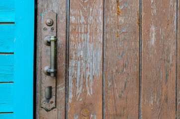 old wooden door and rusty iron lock