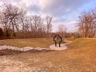 Fototapeta premium Natural park landscape in Kiev Ukraine. Walking in the park. Church bell religious monument. 